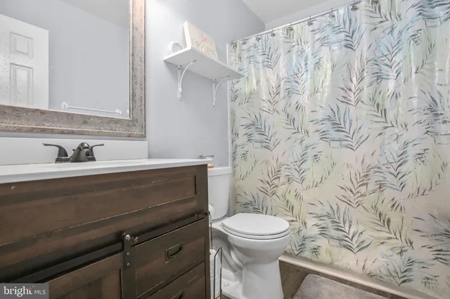 a bathroom with a toilet and a sink
