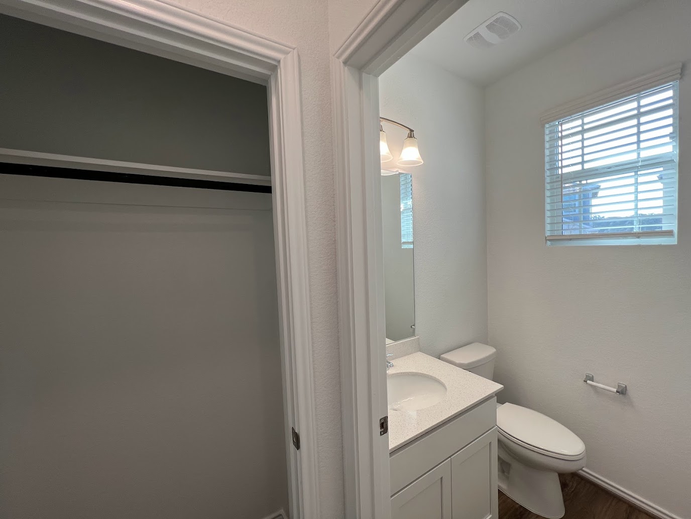 313 Montauk Loop Georgetown, TX 78628 - Photo 13 of 25 a white toilet sitting next to a bathroom sink
