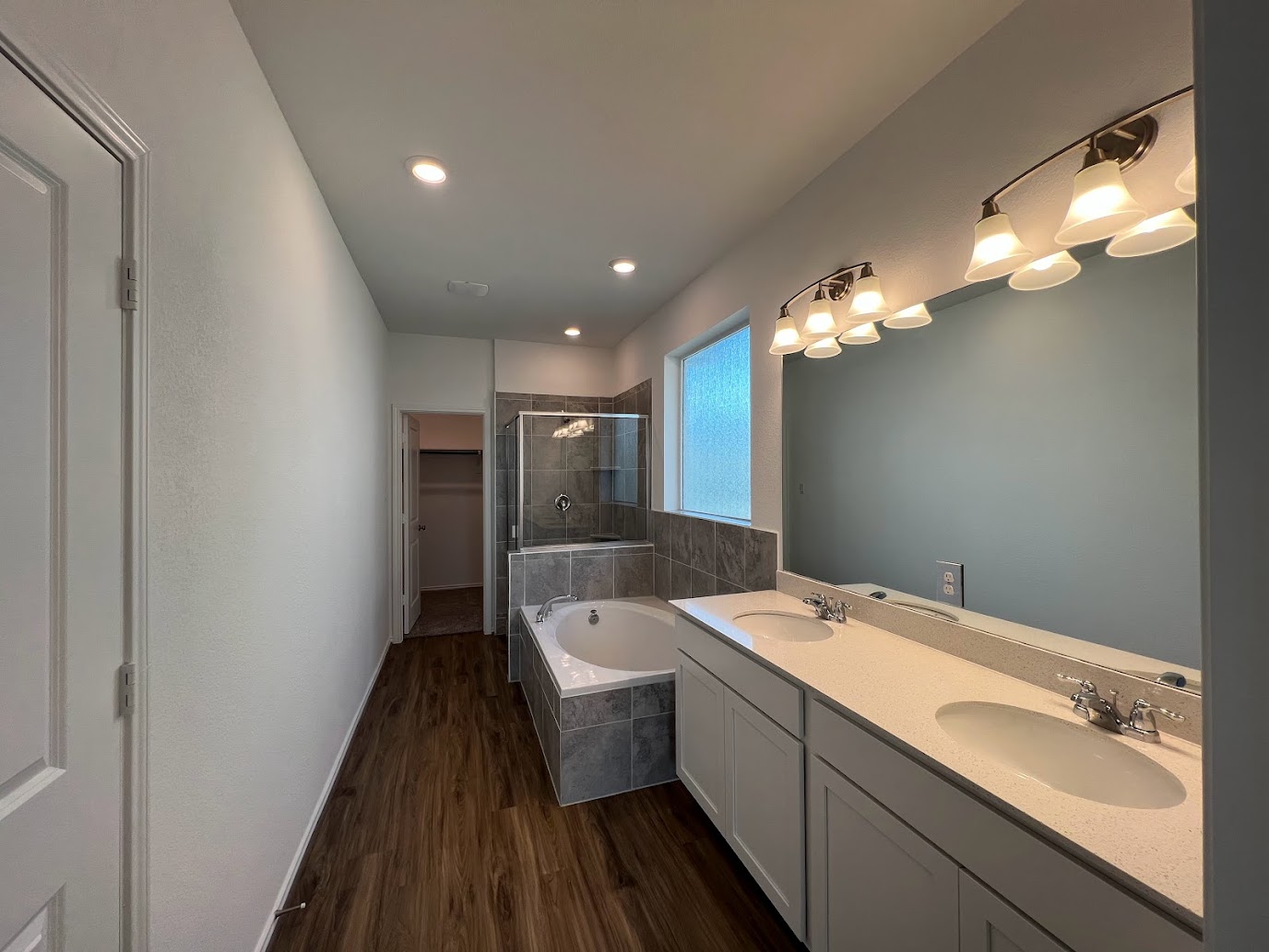 313 Montauk Loop Georgetown, TX 78628 - Photo 21 of 25 a bathroom with a double vanity sink and mirror