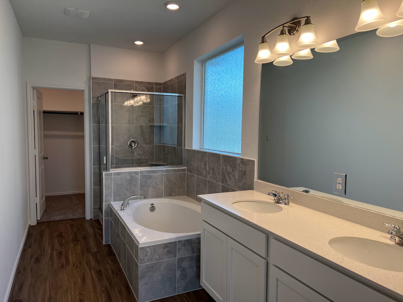313 Montauk Loop Georgetown, TX 78628 - Photo 22 of 25 a bathroom with a bathtub and a sink