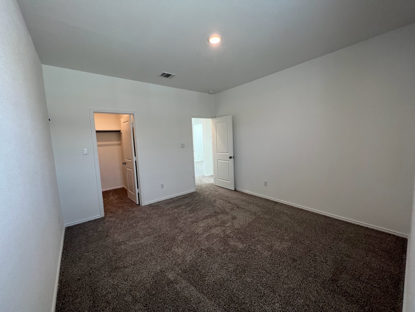 313 Montauk Loop Georgetown, TX 78628 - Photo 8 of 25 a view of a big room with closet and wooden floor