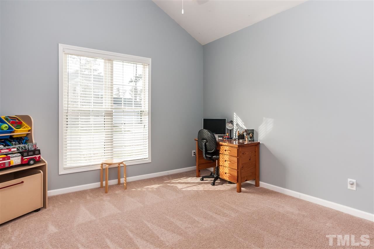 5421 Neuse Forest Road Raleigh, NC 27616 - Photo 15 of 21 a view of a workspace with furniture and a window