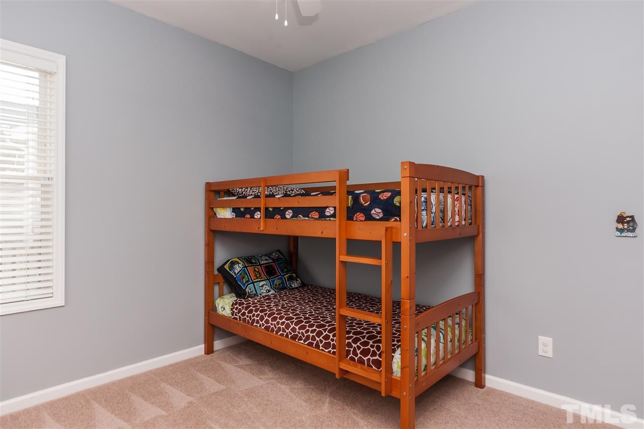 5421 Neuse Forest Road Raleigh, NC 27616 - Photo 17 of 21 a bedroom with a bed and a window
