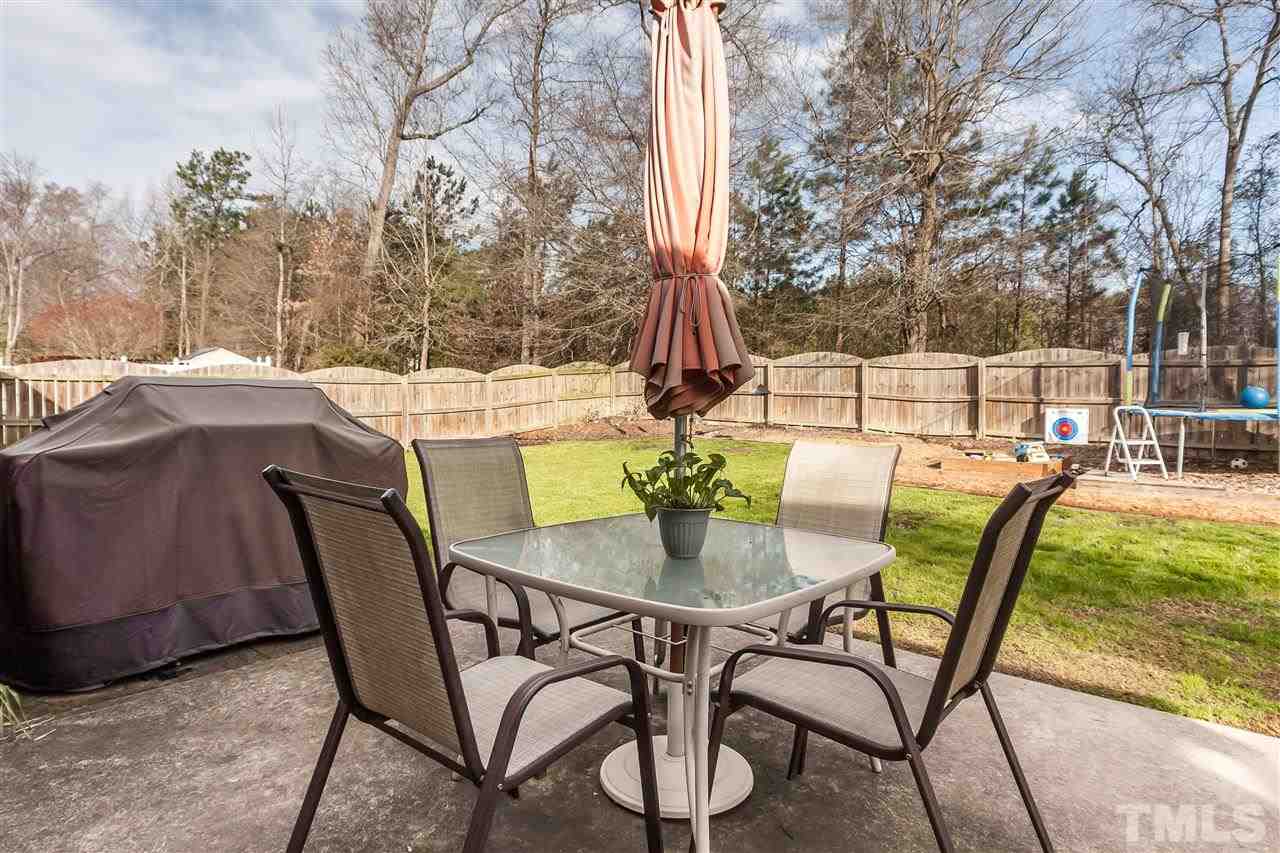 5421 Neuse Forest Road Raleigh, NC 27616 - Photo 18 of 21 a patio with table and chairs