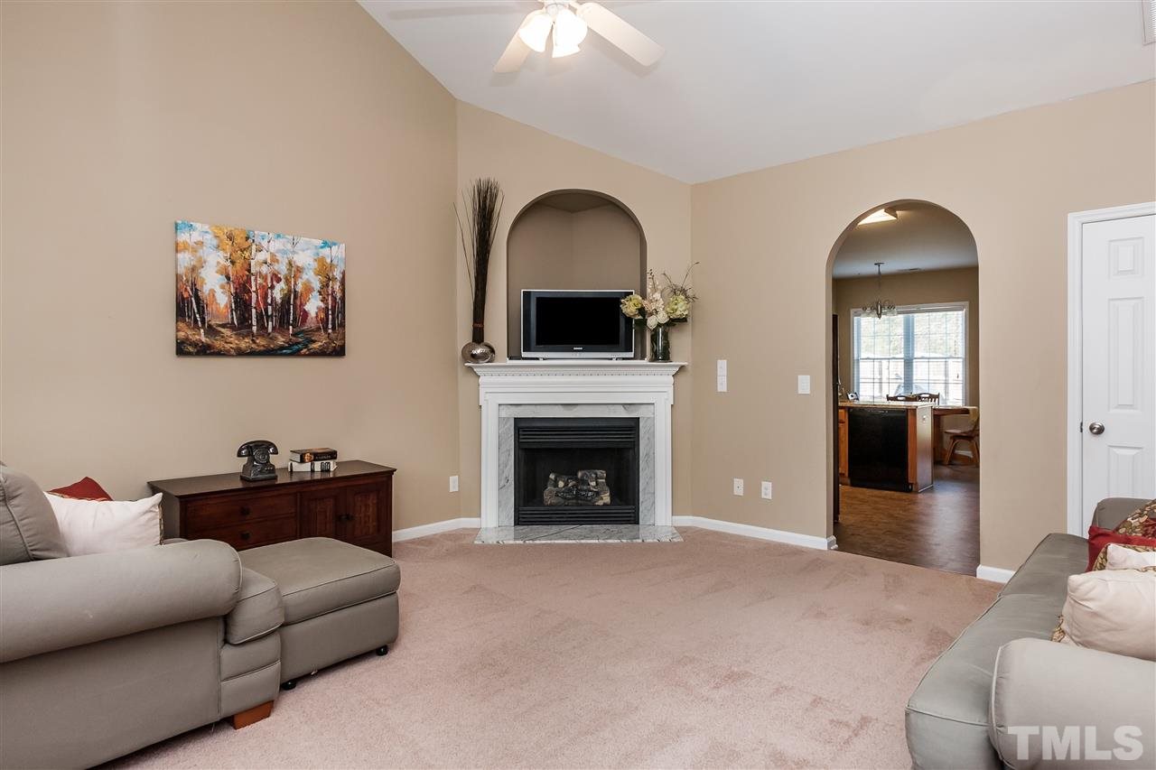 5421 Neuse Forest Road Raleigh, NC 27616 - Photo 3 of 21 a living room with furniture and a fireplace