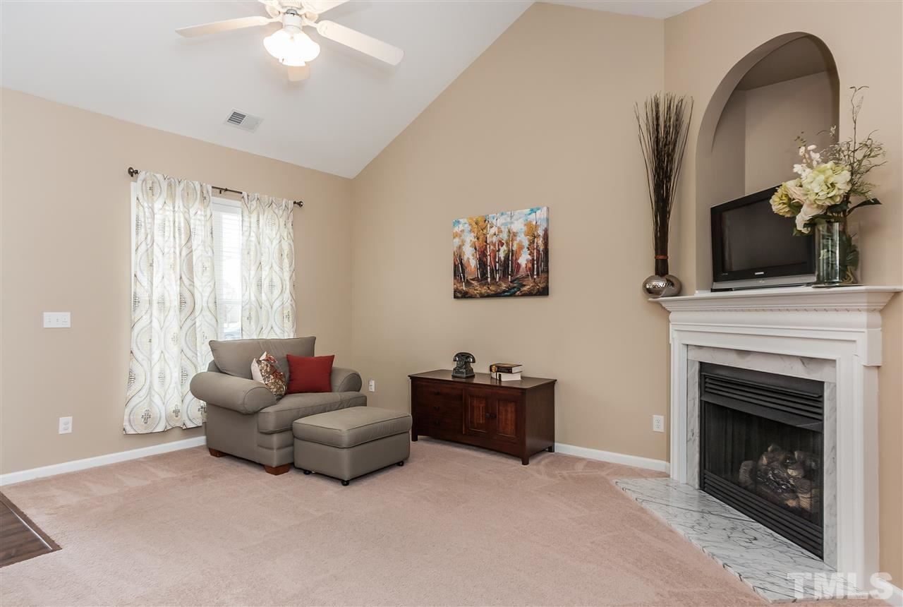 5421 Neuse Forest Road Raleigh, NC 27616 - Photo 4 of 21 a living room with furniture and a fireplace