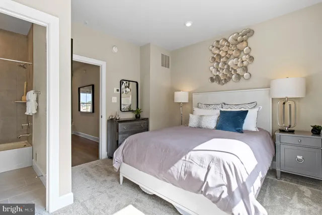 a bedroom with a bed and a view of bathroom