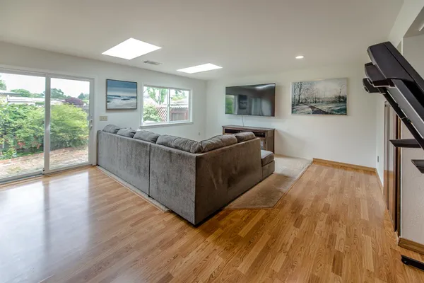 a living room with furniture and a window