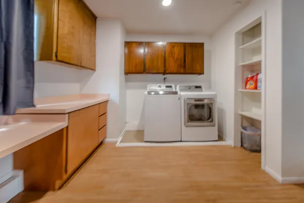 a bathroom with a tub shower and sink