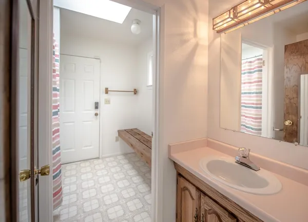 a bathroom with a bathtub and shower