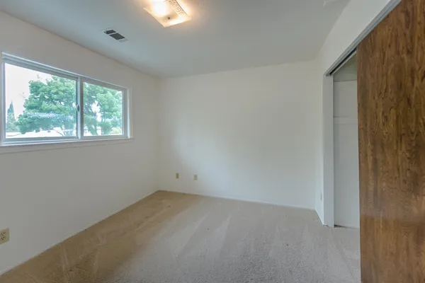 a bathroom with a tub and shower