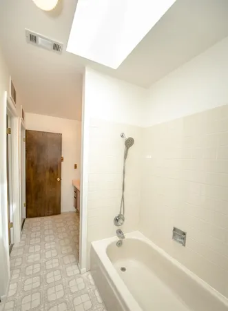 a bathroom with a sink a toilet and mirror