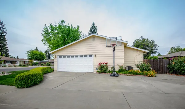 a view of a house with garden and plants