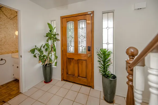 a view of a entryway with flower pots