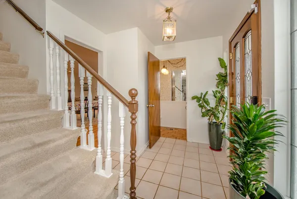 a view of an entryway with flower pots