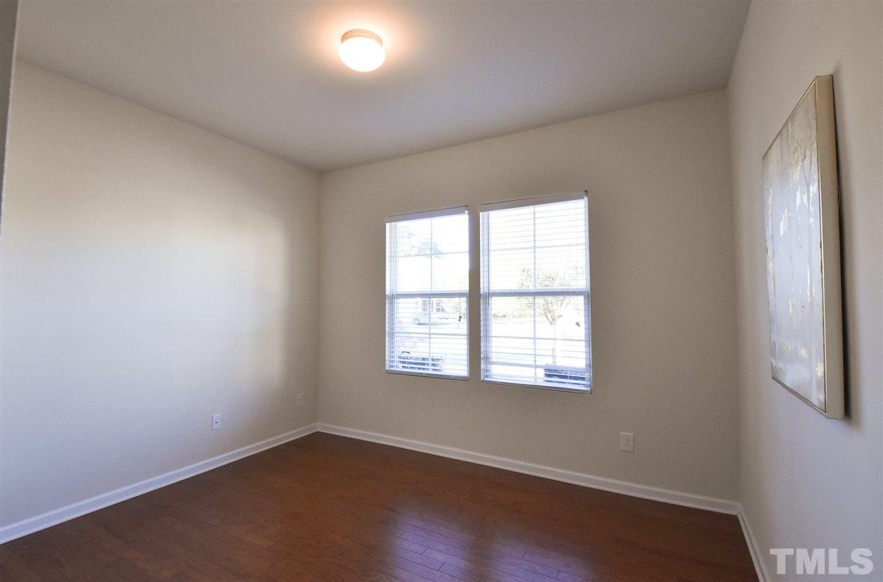 4201 Kellett Lane Raleigh, NC 27616 - Photo 12 of 30 1st floor Bedroom or Office w/lg closet, hardwood floor & adjacent full Bath.
