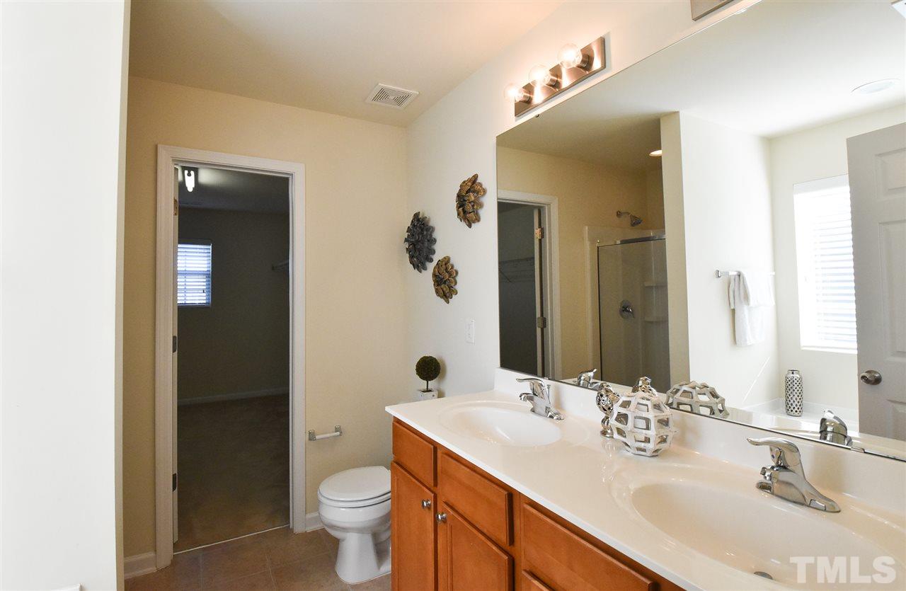 4201 Kellett Lane Raleigh, NC 27616 - Photo 18 of 30 Master Bath offers double sinks, soaking tub, separate shower & neutral vinyl floor.