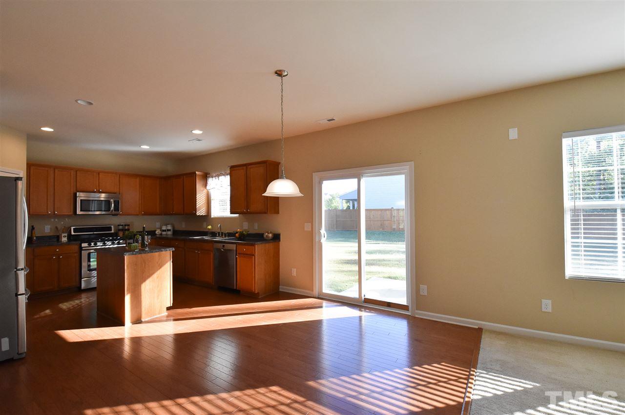 Spacious Bfast area w/sliders to Patio open to great Kitchen w/lots of tall maple cabinets, SS appls (5-burner gas range/MW/NEW Bosch DW), island, WI pantry, granite-look laminate counters & recessed lights.