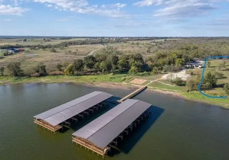 an aerial view of a house having yard