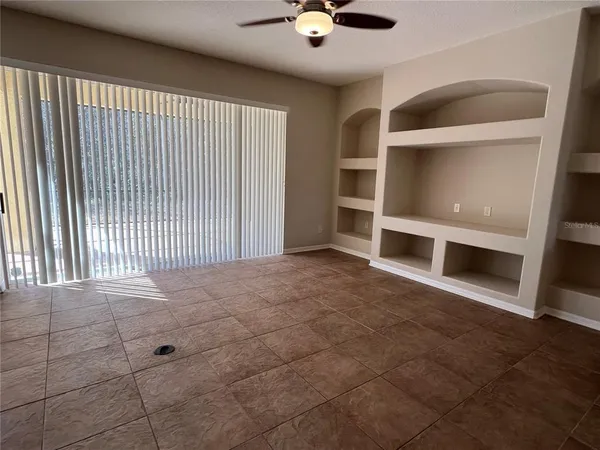 a view of an empty room with a fireplace