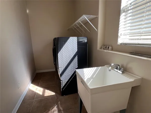a bathroom with a sink and mirror