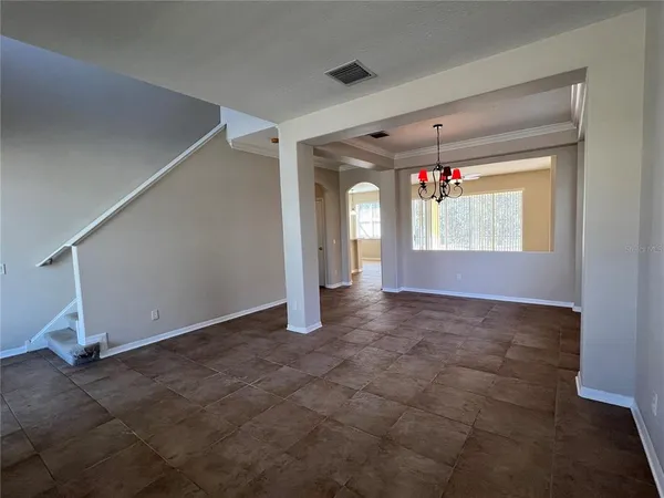 a view of hallway with livingroom and stairs