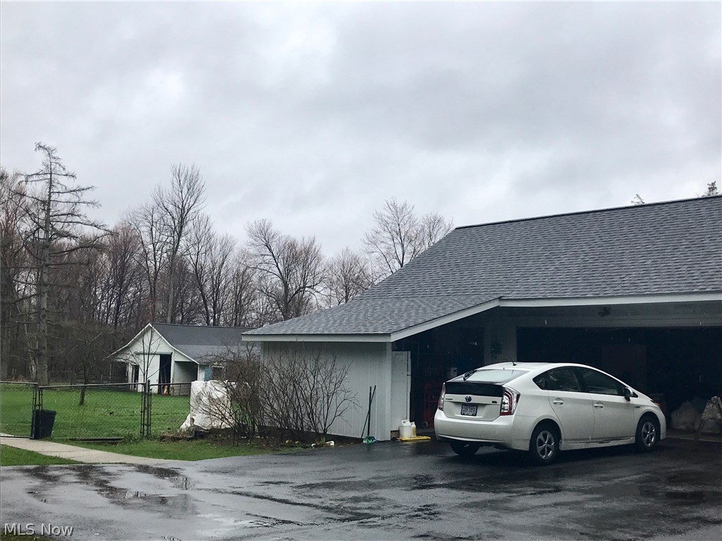 16208 Rapids Road Burton, OH 44021 - Photo 17 of 20 Detached garage with new siding and extra storage space or workshop area