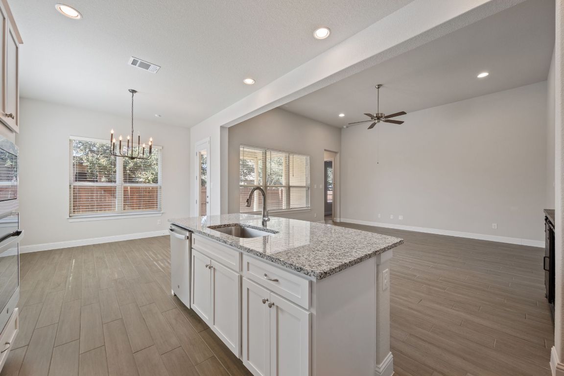 1601 Highland Ridge Road Georgetown, TX 78628 - Photo 35 of 37 wooden floor in an empty room with a window