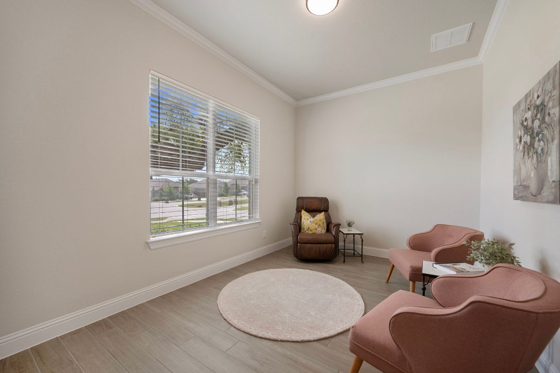 1601 Highland Ridge Road Georgetown, TX 78628 - Photo 21 of 37 a living room with furniture a rug and a window