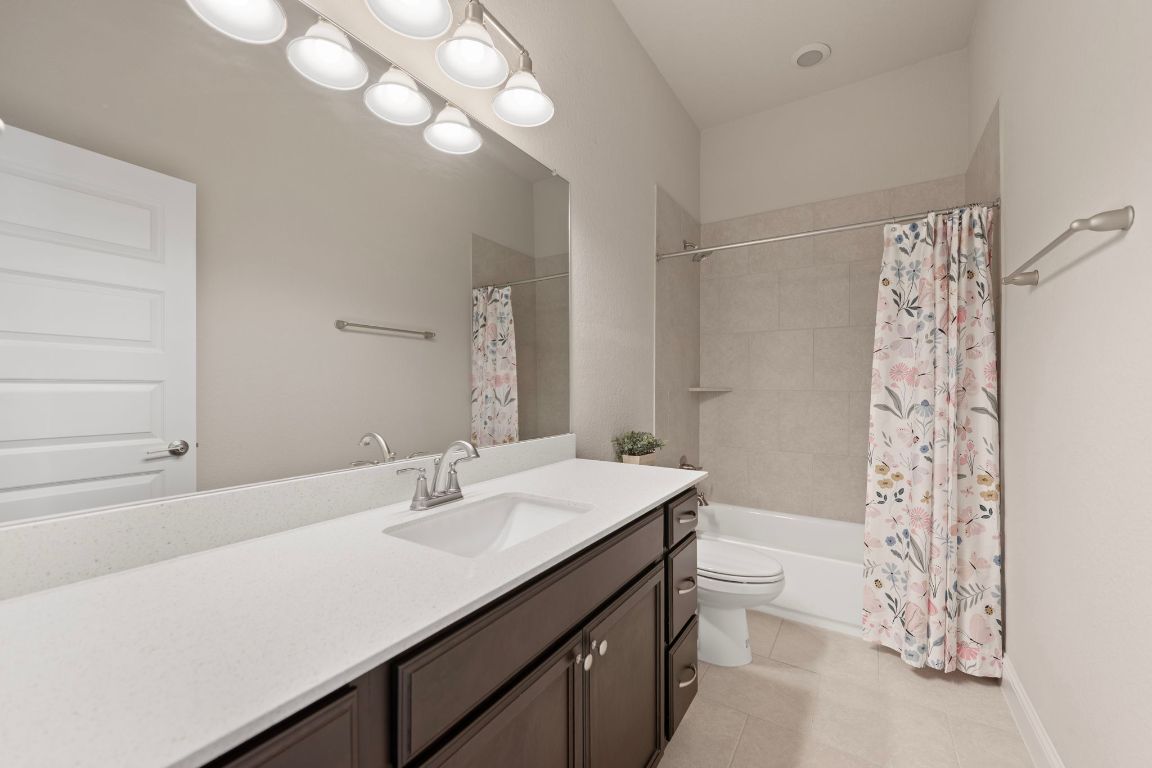 1601 Highland Ridge Road Georgetown, TX 78628 - Photo 28 of 37 a bathroom with a sink a toilet and shower