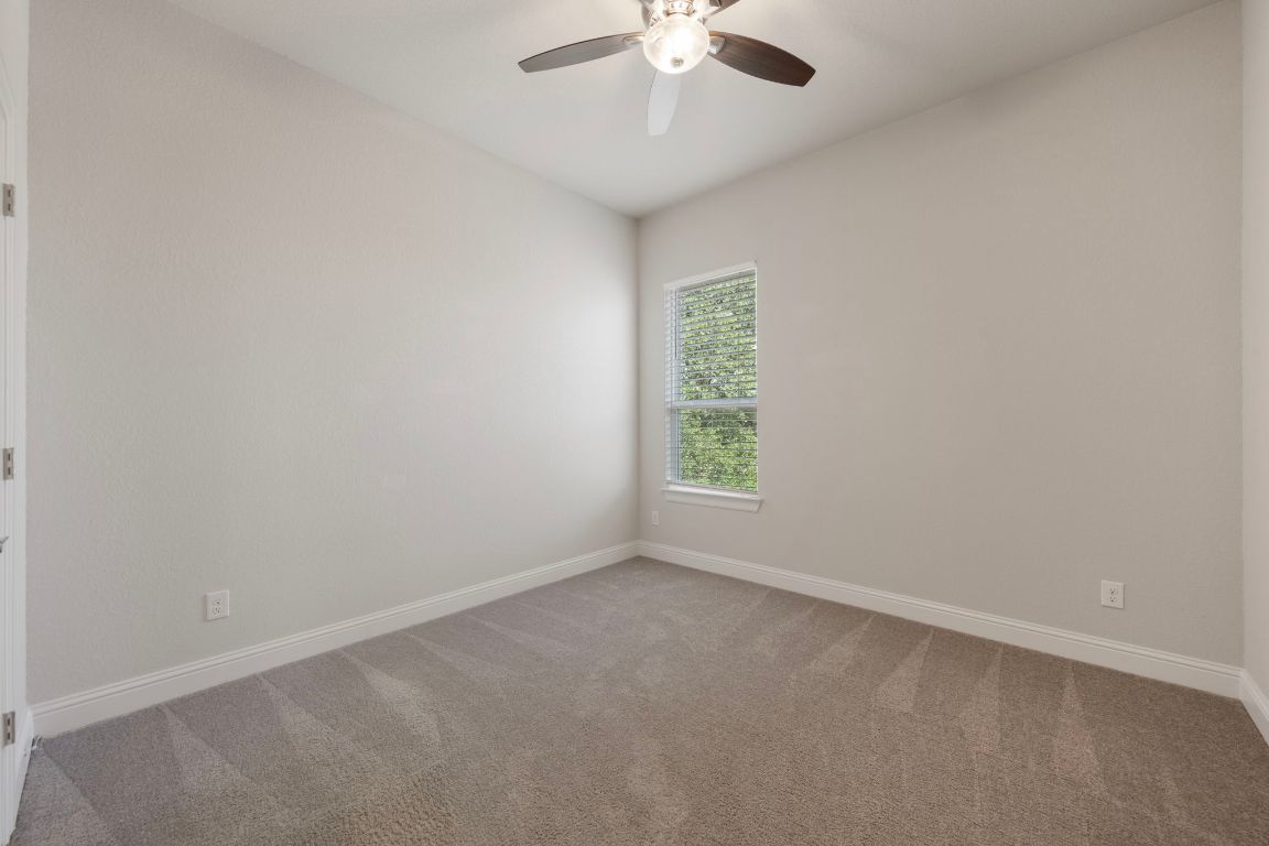 1601 Highland Ridge Road Georgetown, TX 78628 - Photo 29 of 37 an empty room with a window and a fan