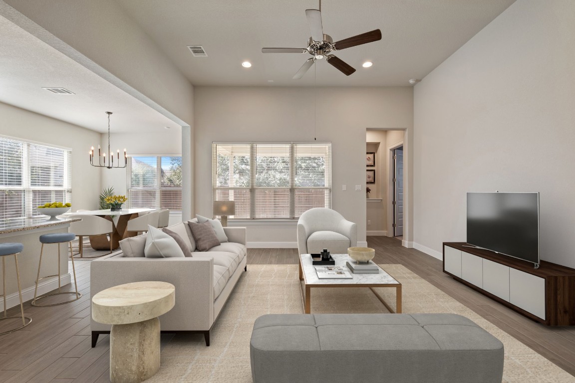 1601 Highland Ridge Road Georgetown, TX 78628 - Photo 4 of 37 a living room with furniture and a flat screen tv