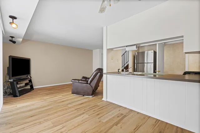 a room with wooden floor and furniture