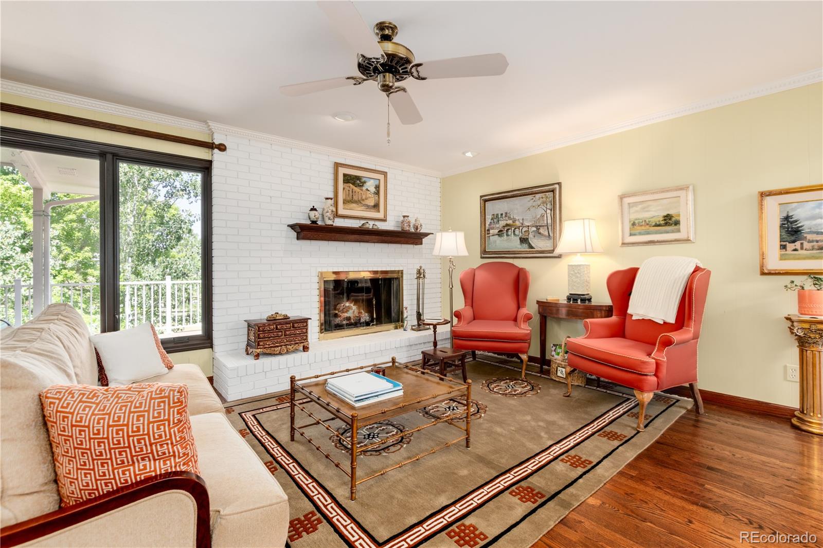 7846 North Village Road Parker, CO 80134 - Photo 14 of 50 a living room with furniture fireplace and a large window