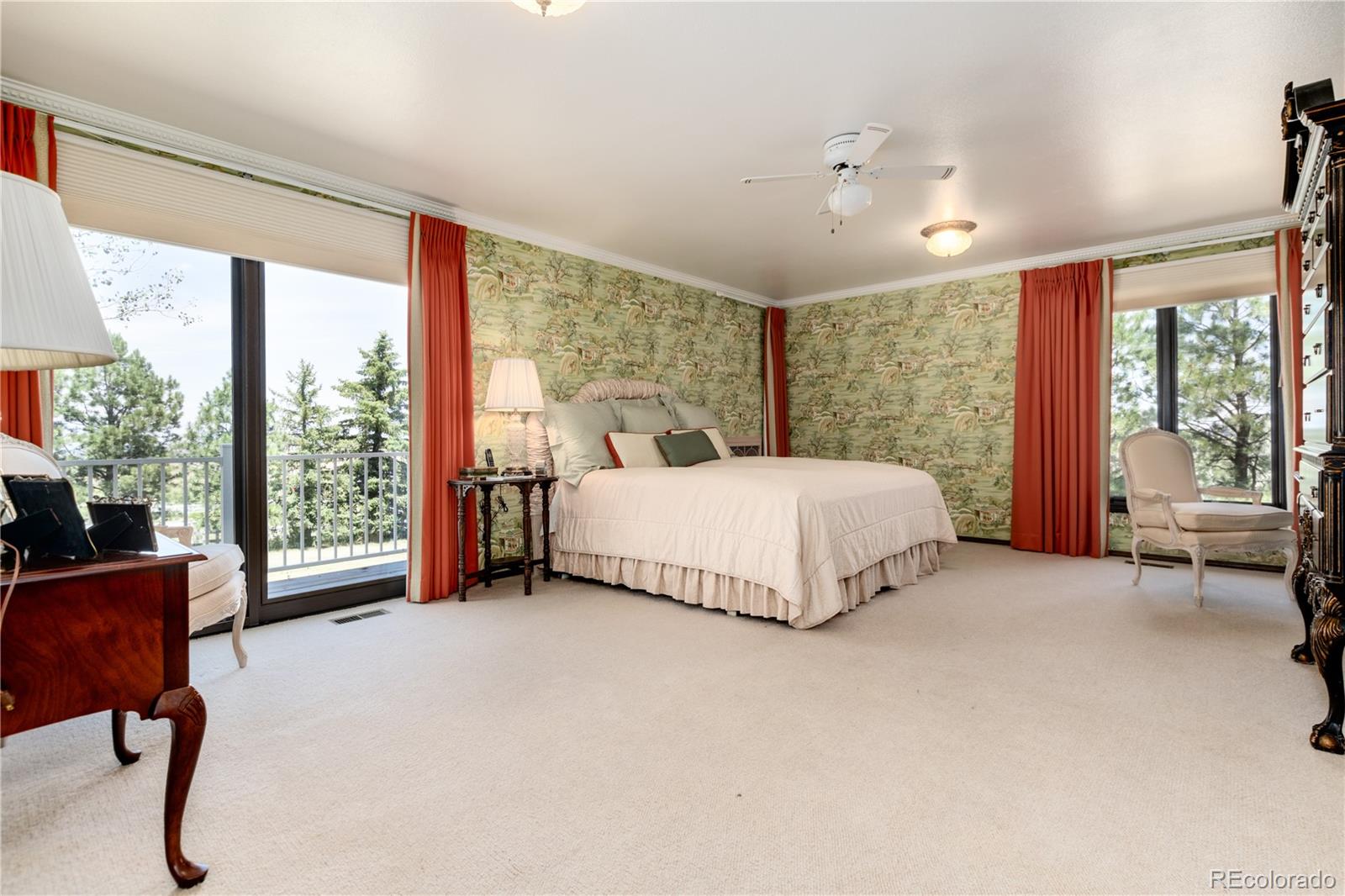 7846 North Village Road Parker, CO 80134 - Photo 22 of 50 a bedroom with a bed and a large window