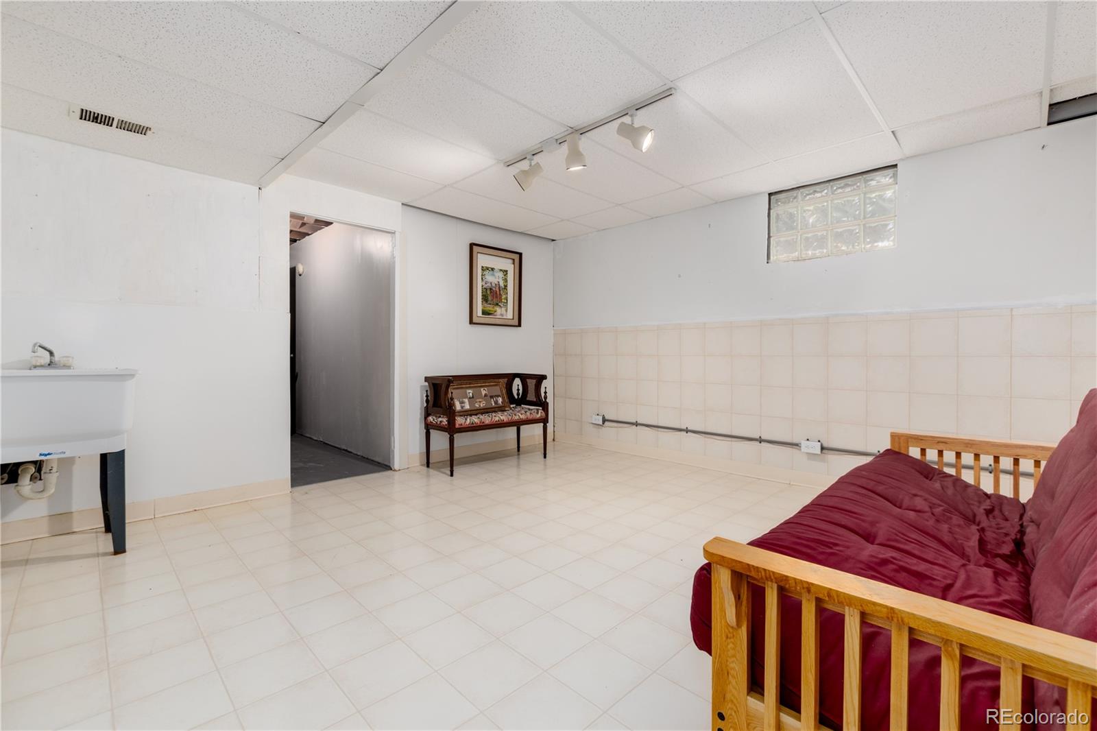 7846 North Village Road Parker, CO 80134 - Photo 37 of 50 a bedroom with furniture and a window