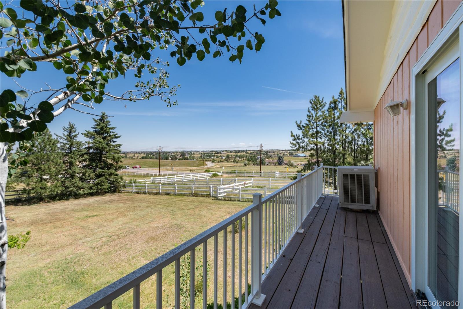 7846 North Village Road Parker, CO 80134 - Photo 40 of 50 a view of balcony with wooden floor and fence