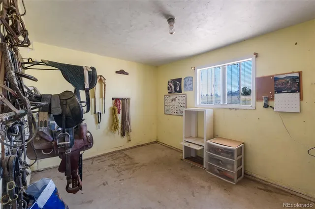 a view of a patio with couches and table and chairs and potted plants