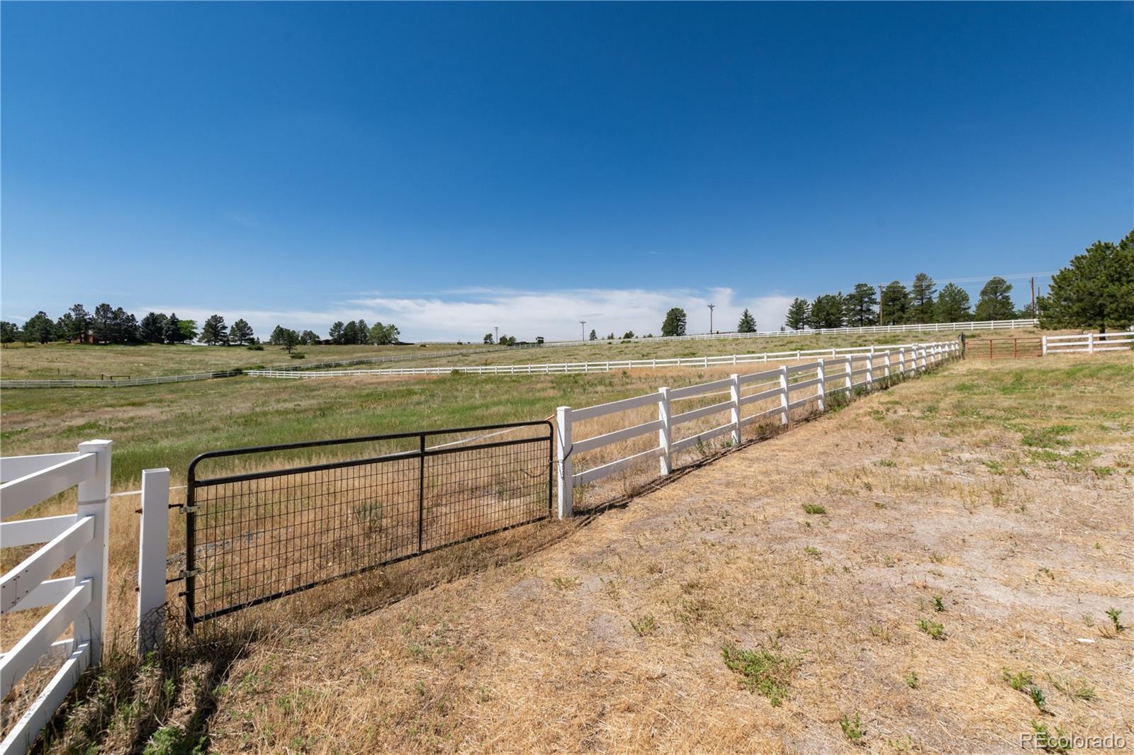 7846 North Village Road Parker, CO 80134 - Photo 48 of 50 a view of an ocean and trees