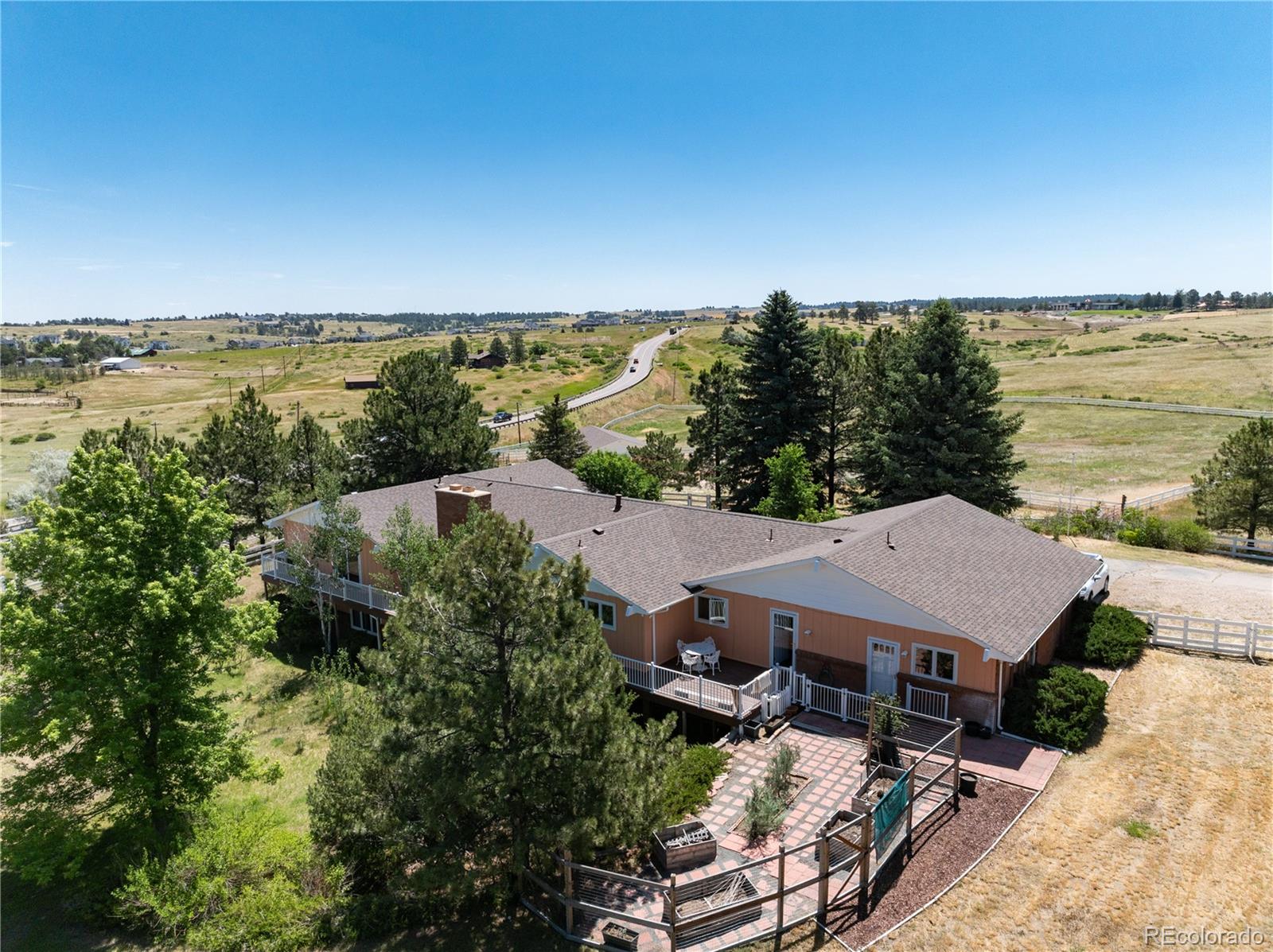 7846 North Village Road Parker, CO 80134 - Photo 6 of 50 an aerial view of a house with a lake view