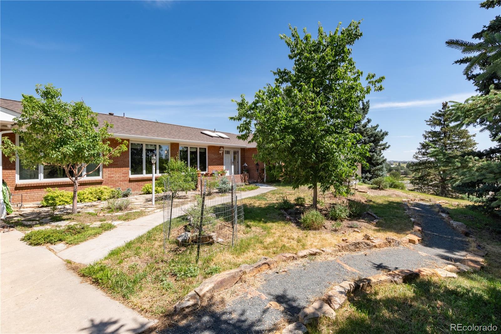7846 North Village Road Parker, CO 80134 - Photo 8 of 50 a view of a house with swimming pool