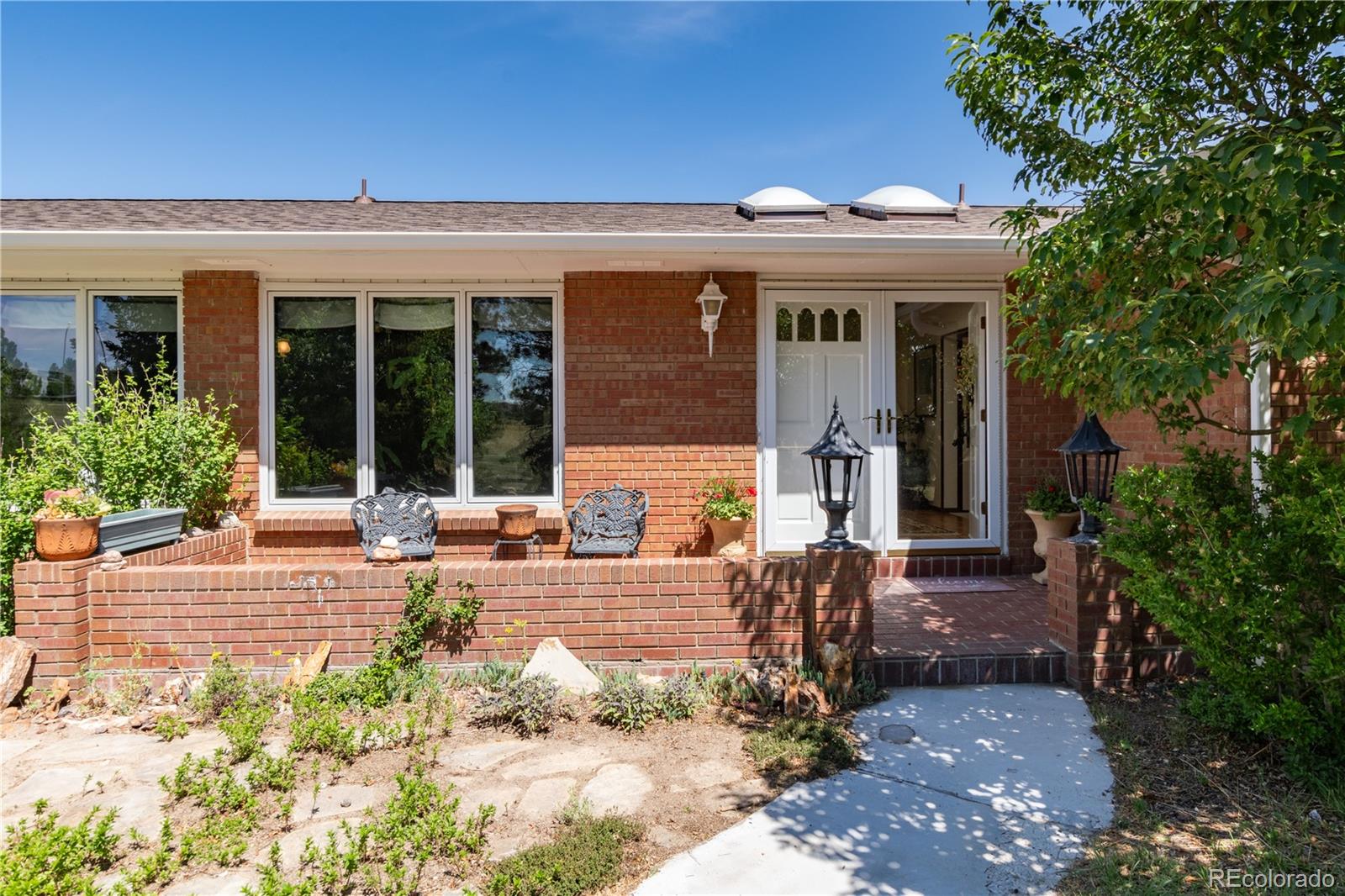 7846 North Village Road Parker, CO 80134 - Photo 9 of 50 front view of a house with a patio