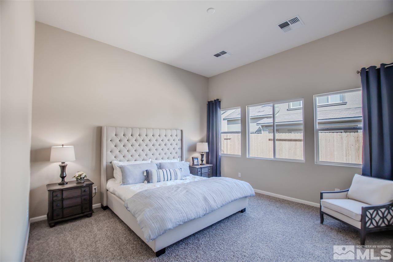 9420 Stony Hill Road, Unit LOT 52 Reno, NV 89521 - Photo 11 of 23 a bedroom with a bed and a couch