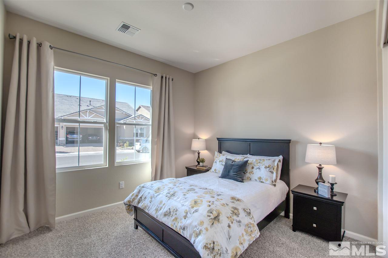 9420 Stony Hill Road, Unit LOT 52 Reno, NV 89521 - Photo 16 of 23 a bedroom with a bed and a night stand