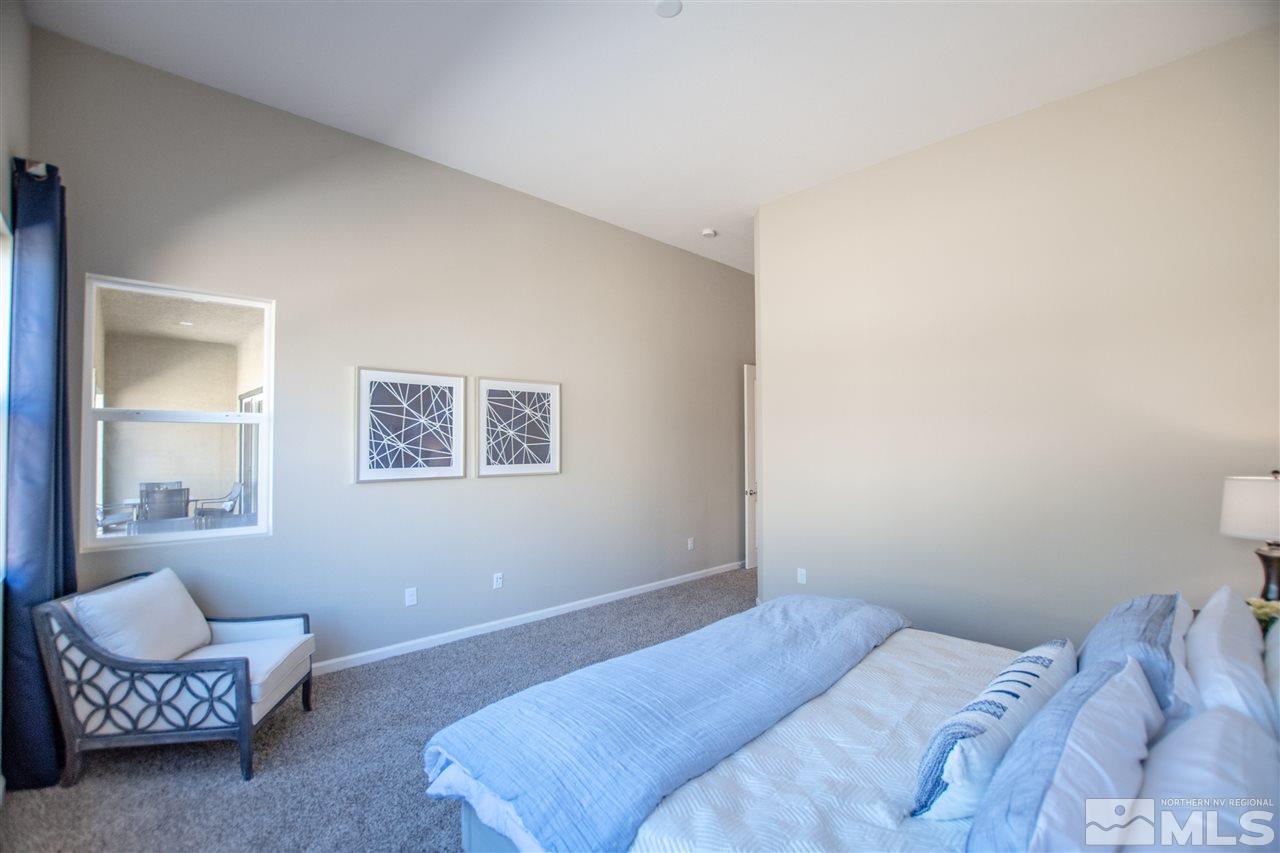 9420 Stony Hill Road, Unit LOT 52 Reno, NV 89521 - Photo 20 of 23 a bedroom with a bed and a couch