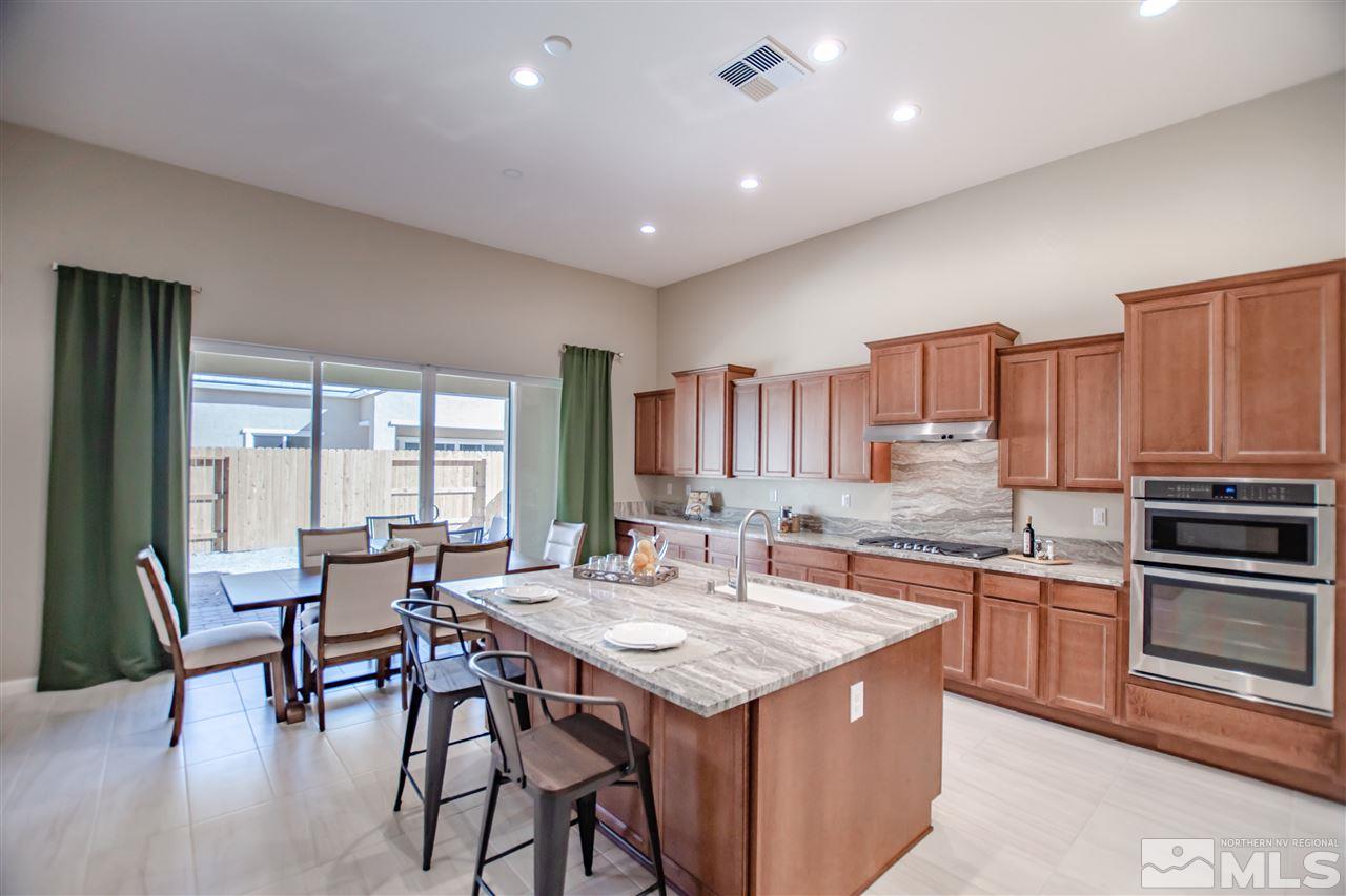 9420 Stony Hill Road, Unit LOT 52 Reno, NV 89521 - Photo 5 of 23 a kitchen with granite countertop a sink and appliances
