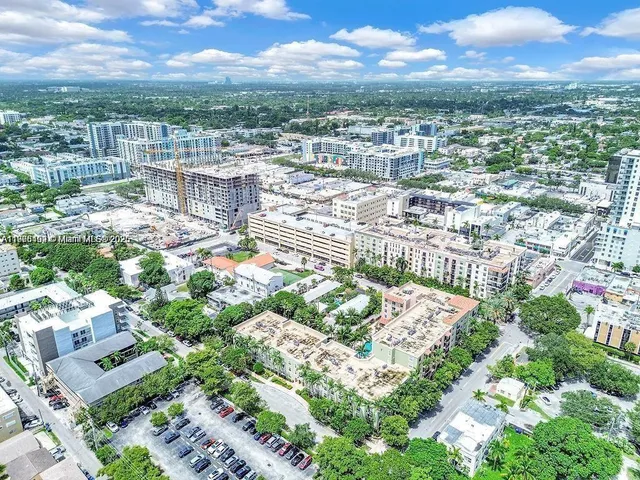 a kitchen with stainless steel appliances a sink stove and refrigerator