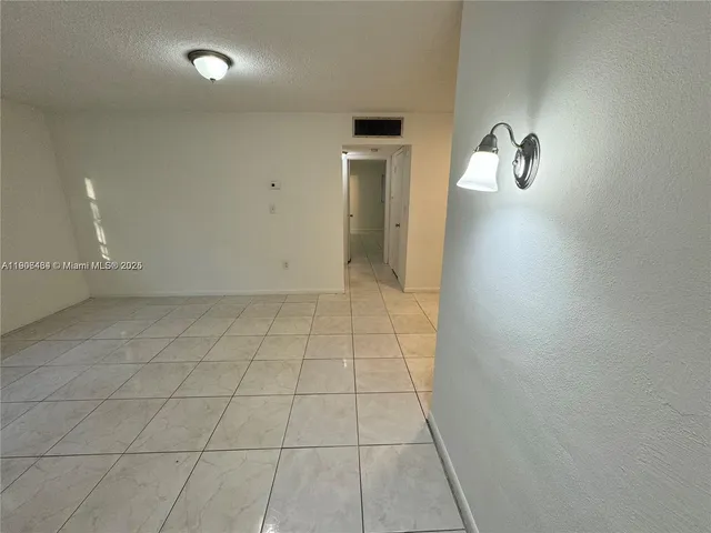 an empty room with a bathroom