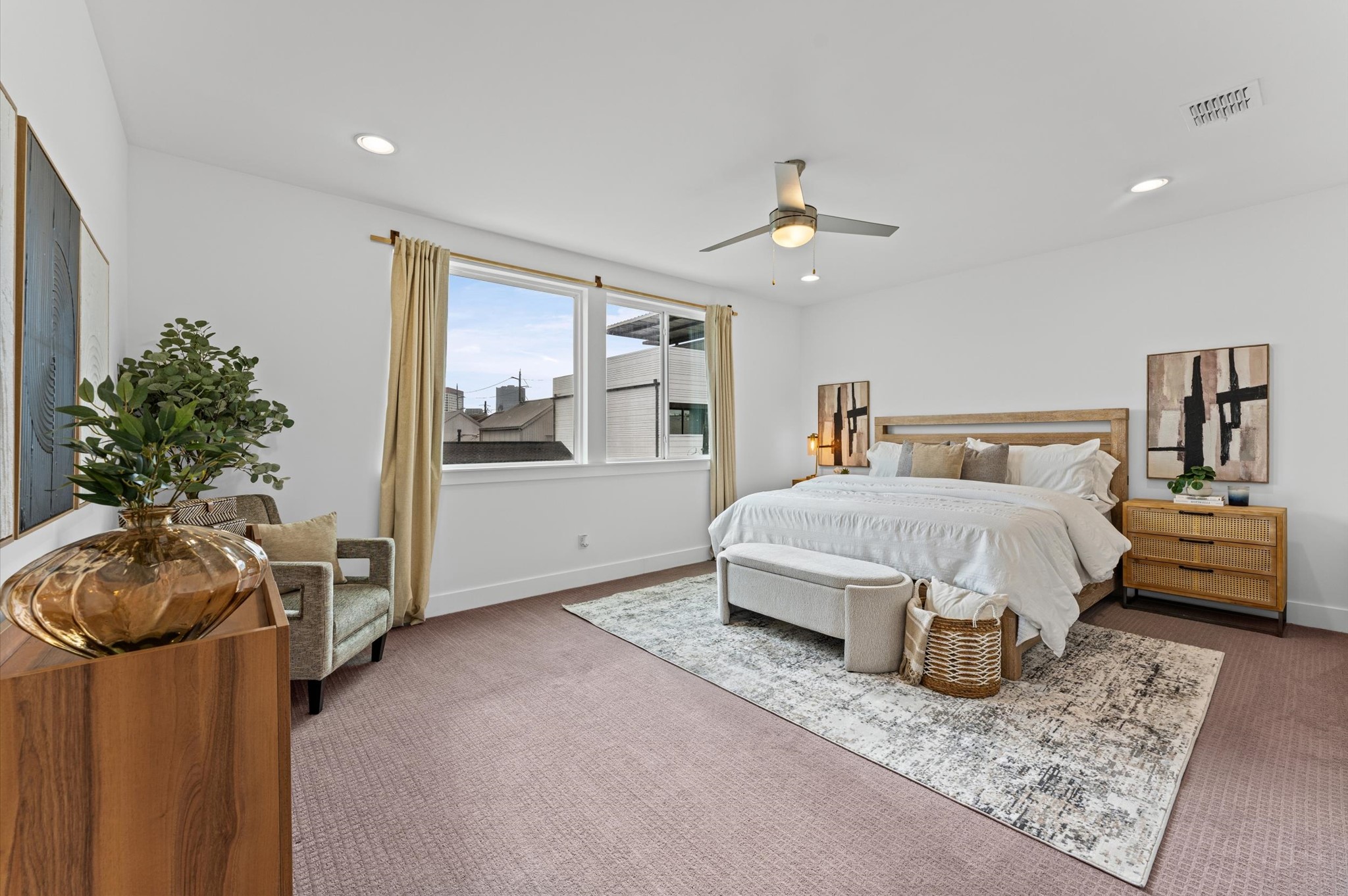 1404 Bailey Street Houston, TX 77019 - Photo 16 of 25 a spacious bedroom with a bed and ceiling fan