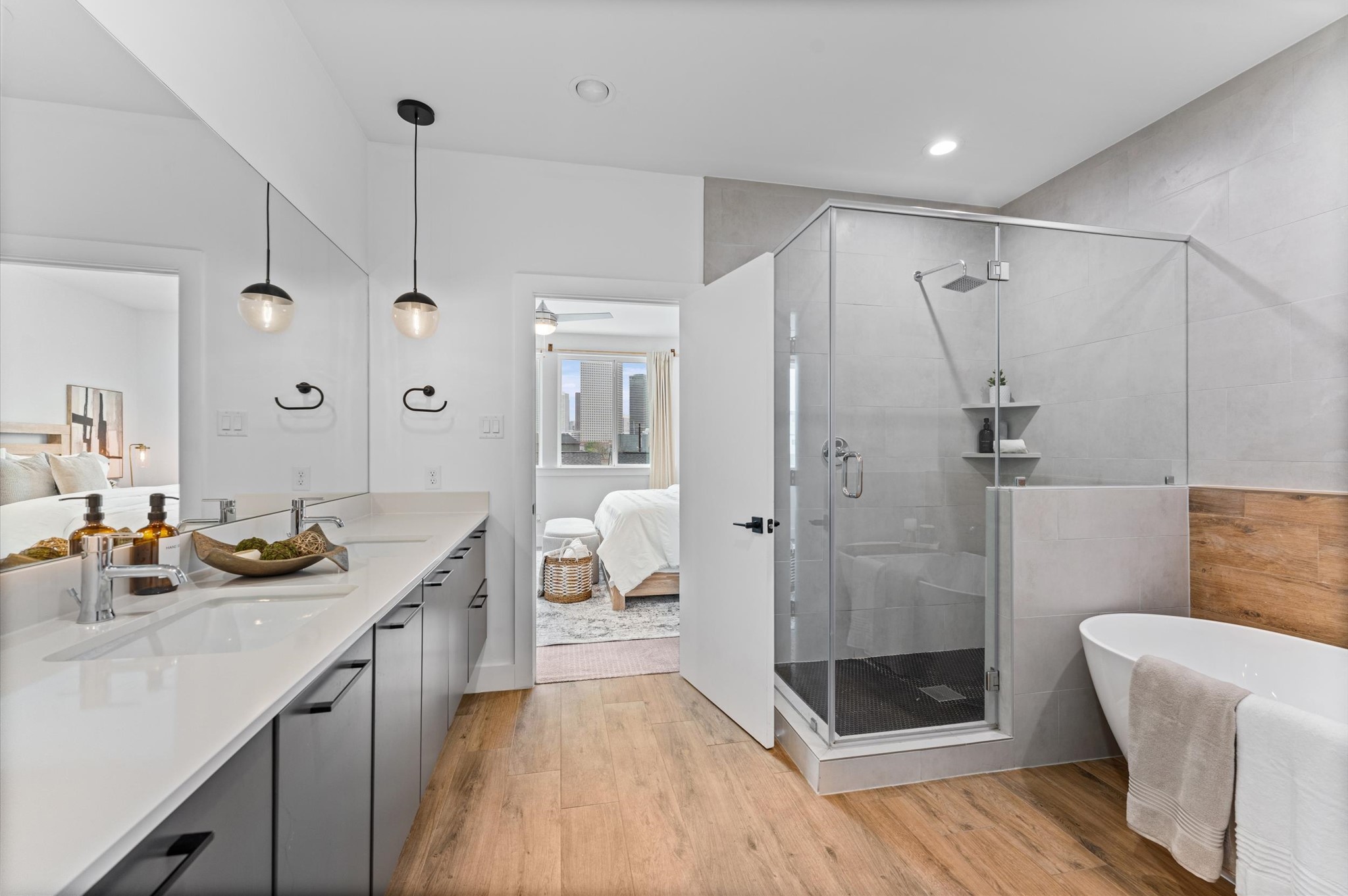 1404 Bailey Street Houston, TX 77019 - Photo 18 of 25 a spacious bathroom with a double vanity sink a large mirror and shower